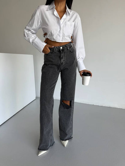 Išblukusios juodos spalvos džinsai